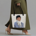 Abdul Sattar Edhi Heritage Tote Bag with full-color portrait print, held by a woman in an olive coat